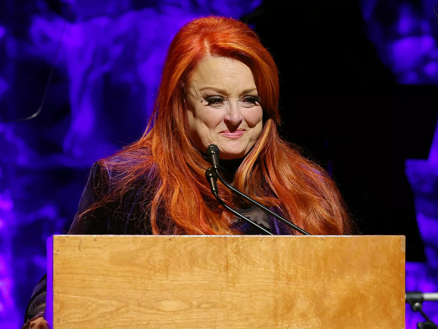 Wynonna Judd speaks onstage for the class of 2021 medallion ceremony at Country Music Hall of Fame and Museum in Nashville, Tennessee. Photo Credit;  TERRY WYATT/GETTY